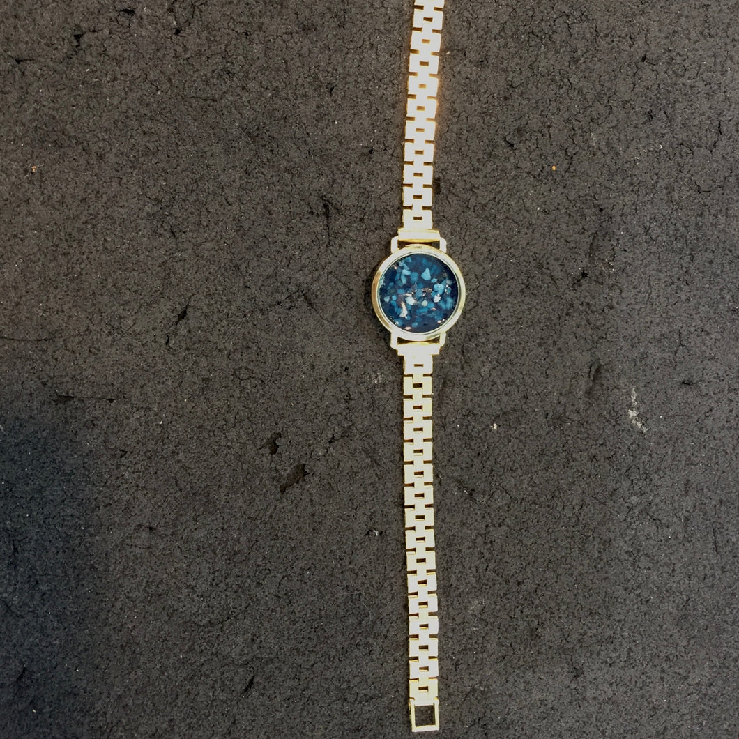 Goud horloge met as